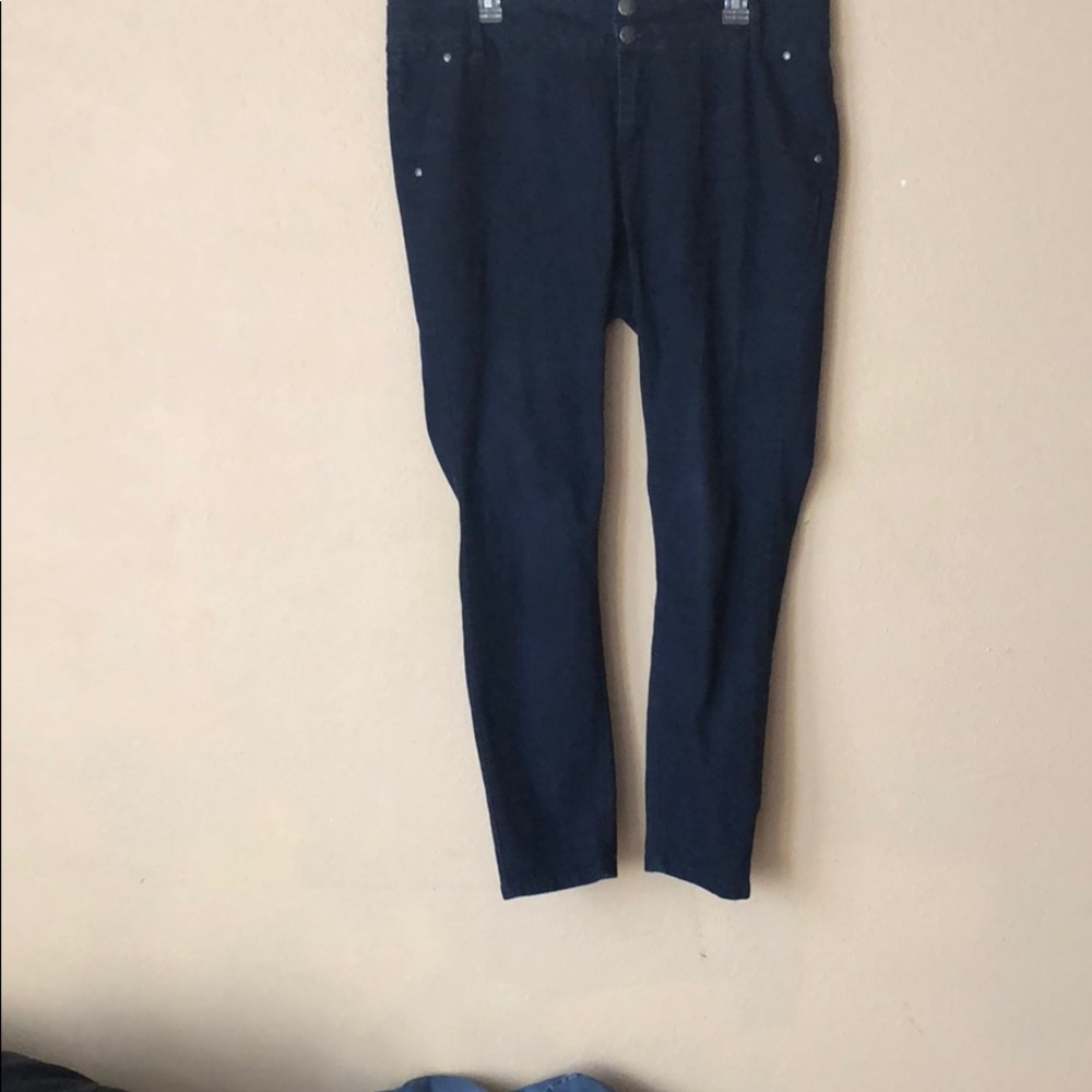 Dark wash blue jeans.